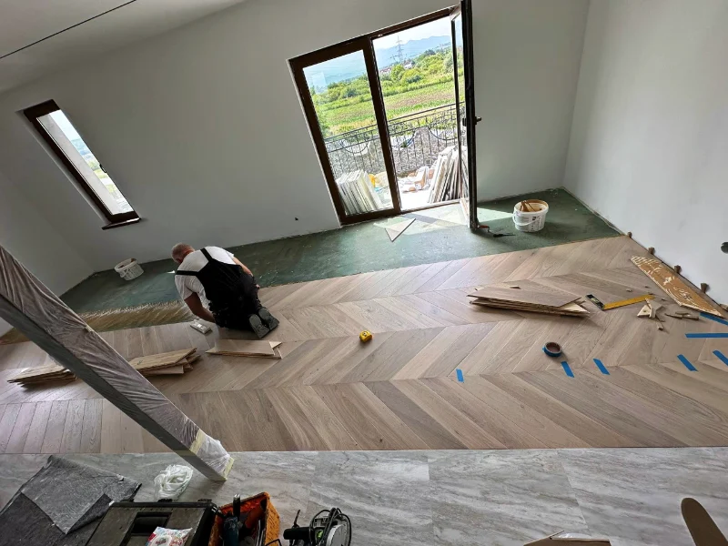 Installing herringbone parquet in an attic room