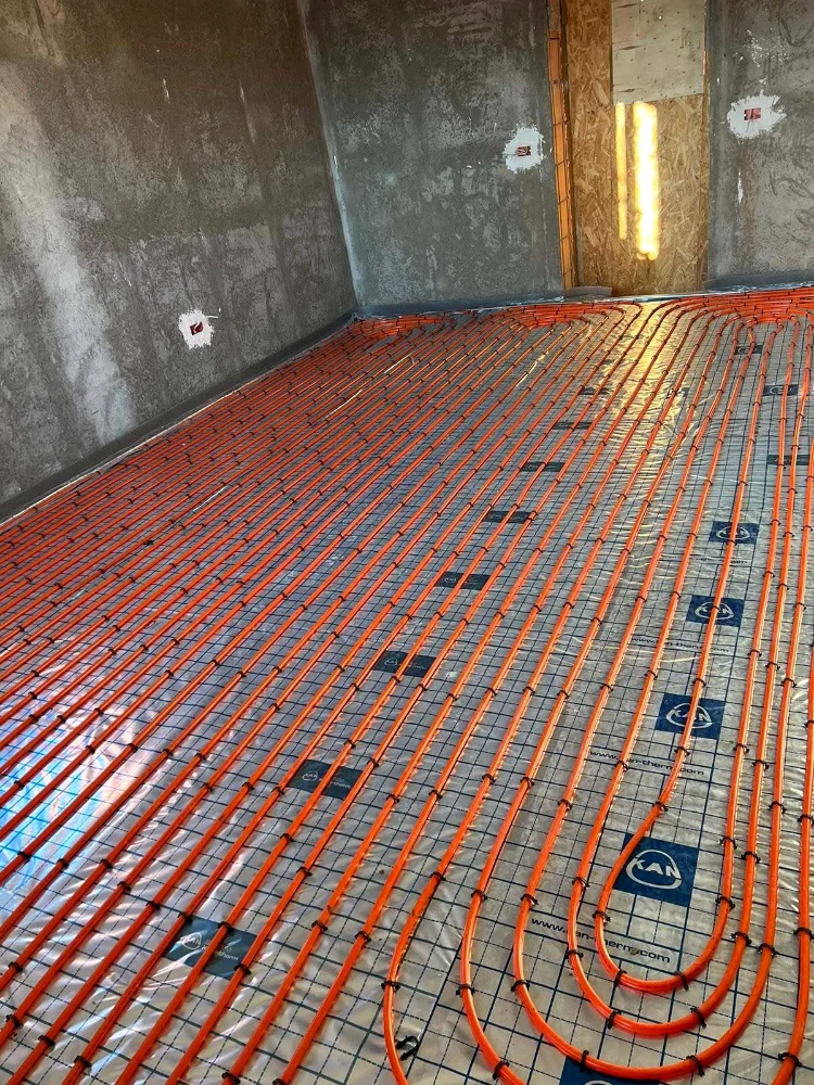 Underfloor heating pipes laid on insulation boards