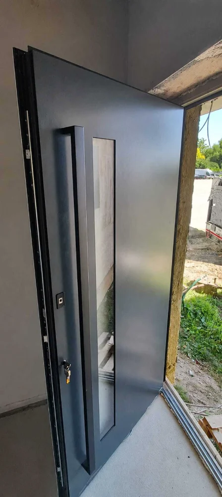 Anthracite entrance door with vertical glass and fingerprint opening, open