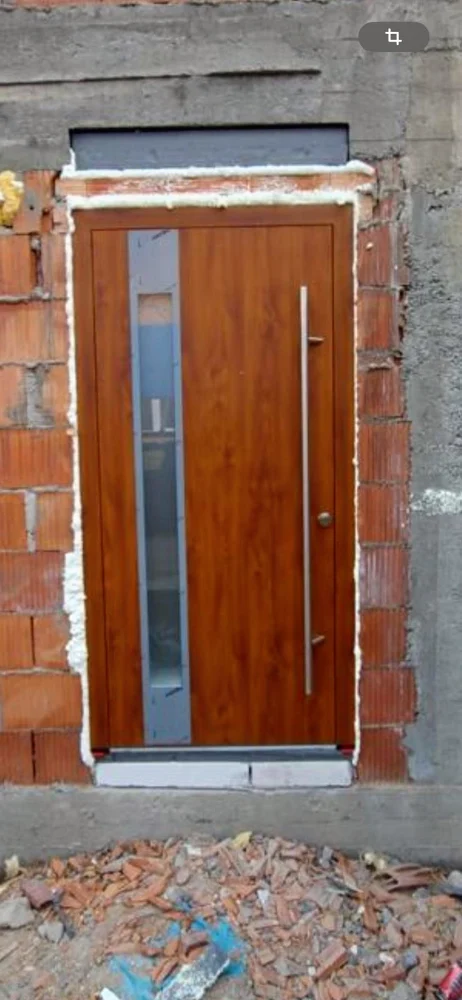 Entrance door with a wood-effect finish and a glass insert