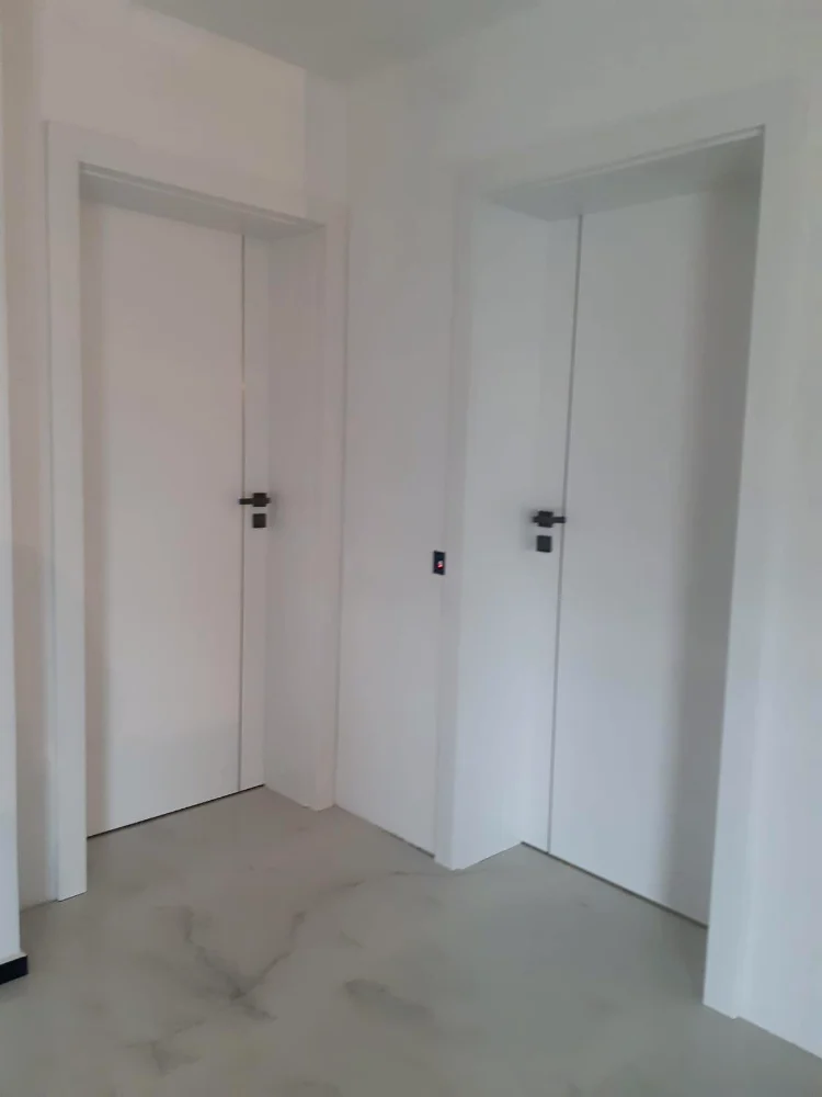 White interior doors with aluminium applications