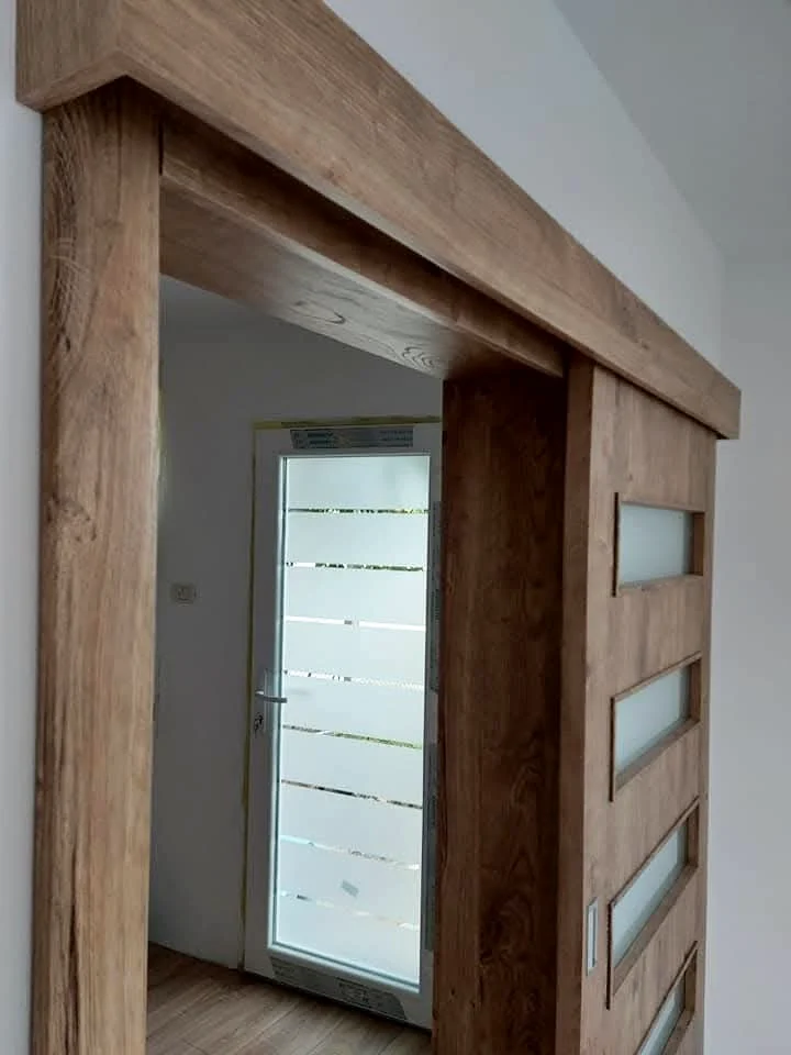 Sliding wood-effect door on an exposed track
