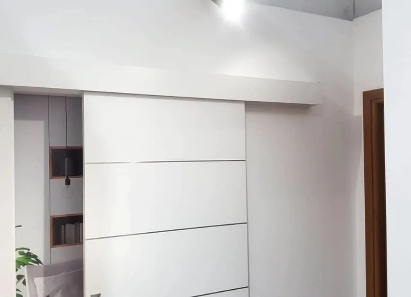 White sliding door mounted on the wall
