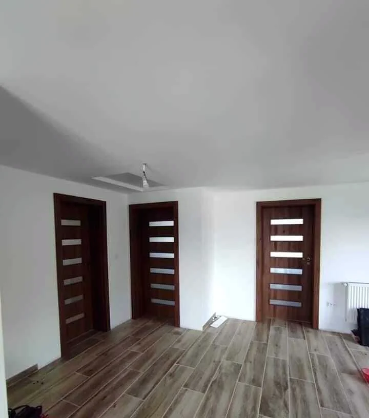 Walnut-effect interior doors with narrow glazed panes