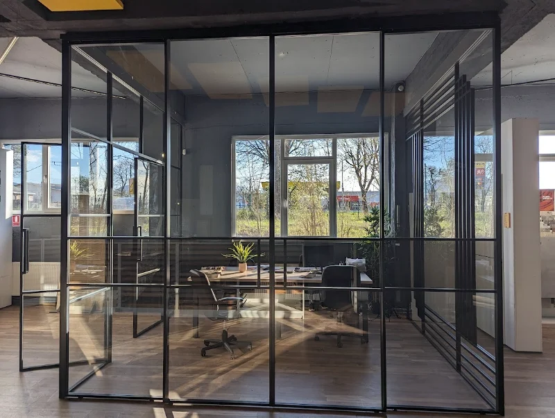 Glass walls with black profiles in a workspace